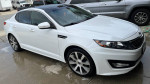 2012 Kia Optima SX FWD in white with 18 inch rims and custom tint, showing sporty design and clean condition.