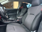 Interior view of a 2018 Subaru Impreza 2.0i Touring with clean seats and modern dashboard features.