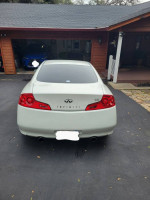 2006 Infiniti G35 Coupe parked in garage, showcasing rear view and upgraded features.