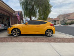 2012 yellow Hyundai Veloster parked on driveway, showcasing sleek design and new parts