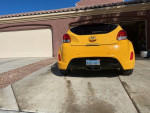 Yellow 2012 Hyundai Veloster parked in driveway with sunroof and backup camera