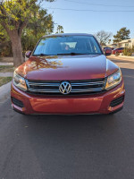 Front view of a 2013 Volkswagen Tiguan S 4Motion AWD in excellent condition parked on a residential street.