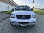Front view of a 2003 Ford Expedition XLT FX4 4WD, white color, with 85,000 mileage.