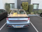 Rear view of a 2021 Hyundai Sonata SE in shimmering silver parked with low mileage and great condition.