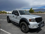 2005 Ford FX4 4X4 truck for sale with leveling kit and oversized tires, perfect for new drivers.