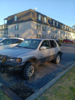 2001 Honda Passport EX RWD parked, needs jump to start, with worn tires and visible wear, for sale at $2500.