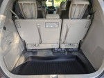 Interior view of 2016 Honda Odyssey SE with rear seats and floor mats, showcasing spacious minivan design.