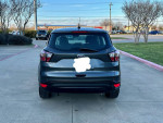 Rear view of a 2017 Ford Escape S FWD parked, showcasing its sleek design and well-maintained condition.